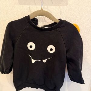H&M Black Sweatshirt with White Monster Face and Yellow Ear Detail
